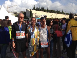From left to right, my dad, me and our friend with our medals outside the stadium